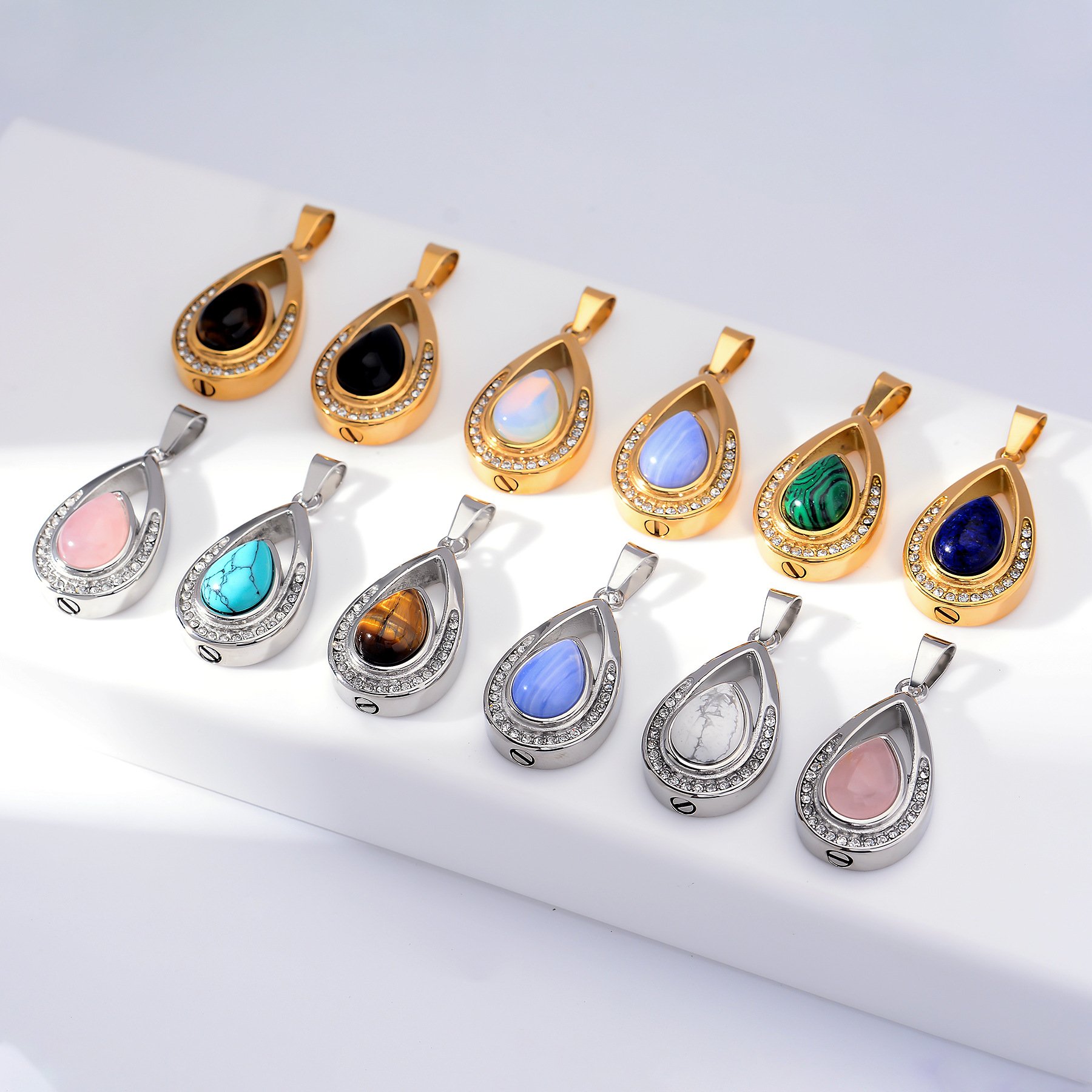 The same teardrop memorial pendant in several natural stone and finish options